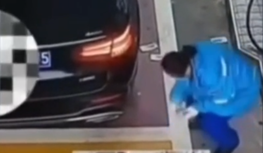 a gas station employee in China collapses