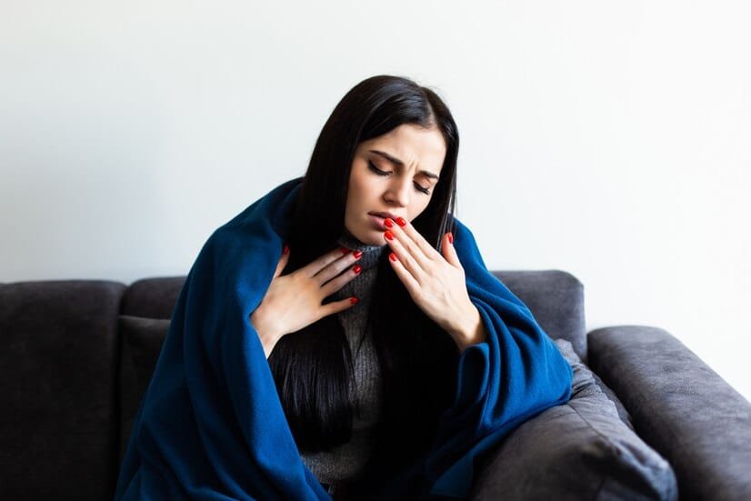 Kalonji: A Natural Cure for Cold and How to Use It Effectively 141 indisposed sick woman feeling her temperature while resting sofa home 231208 1188 1733991435001