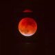 The “Blood Moon” appearance results from Rayleigh scattering—